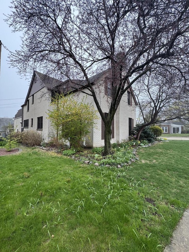 3216 Moorland Ave, Racine, WI 53405 - view of home's exterior with brick siding and a lawn