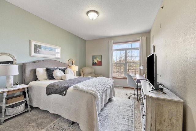 bedroom featuring light colored carpet