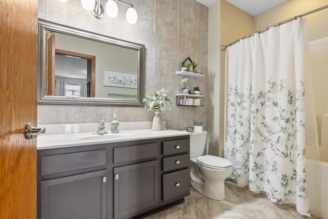 full bathroom with toilet and vanity