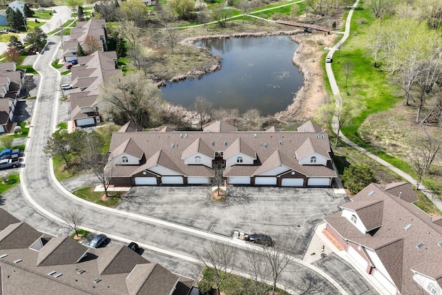 birds eye view of property featuring a residential view and a water view