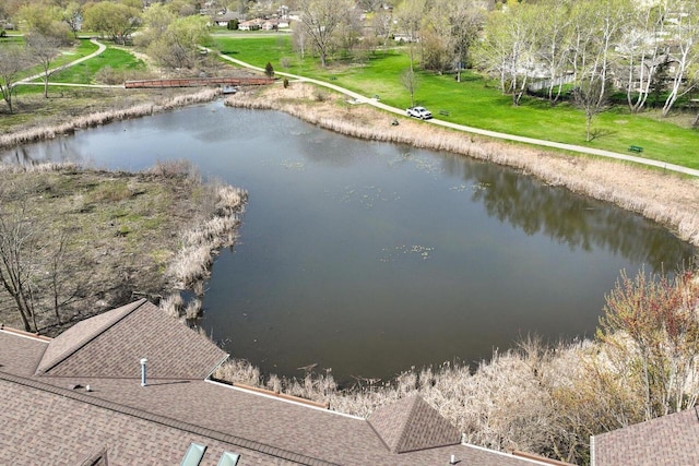 birds eye view of property with a water view