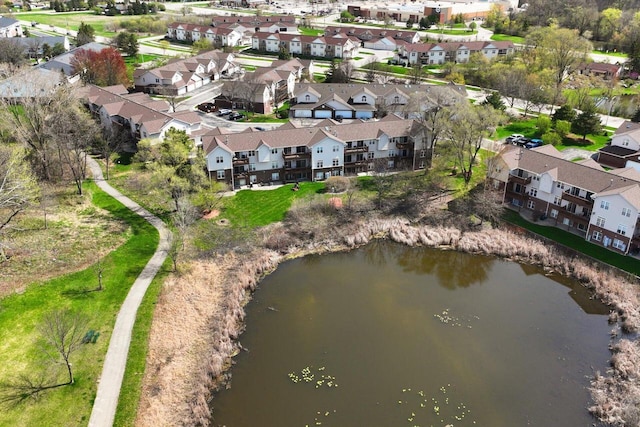 birds eye view of property with a water view and a residential view