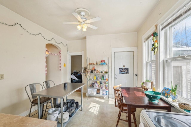 dining space with a ceiling fan
