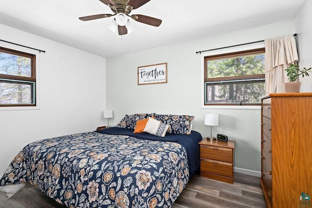 bedroom with baseboards, a ceiling fan, and wood finished floors
