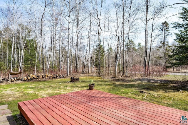 wooden terrace with a yard