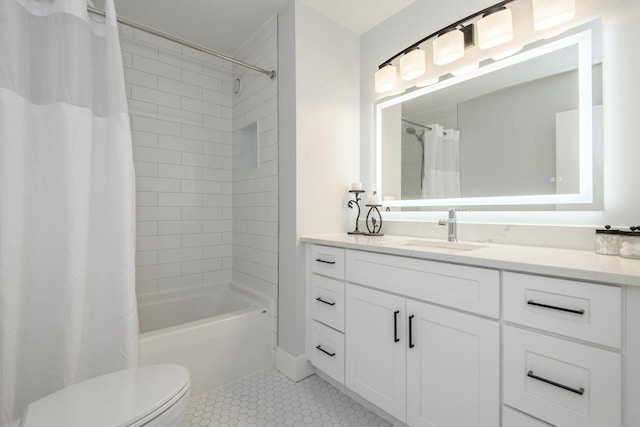 bathroom with vanity, tile patterned floors, shower / bath combination with curtain, and toilet