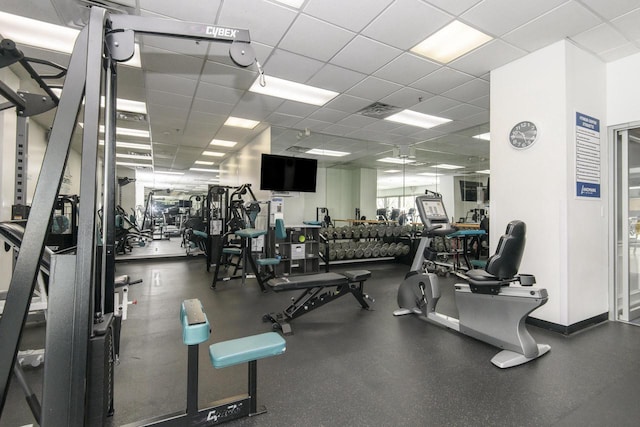 gym featuring visible vents and a paneled ceiling