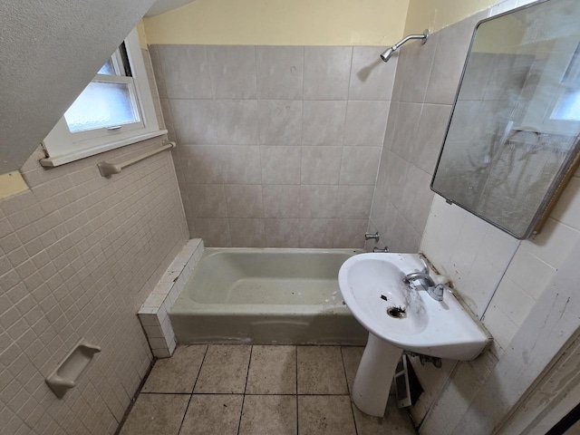 bathroom featuring tile patterned floors, tile walls, and shower / tub combination