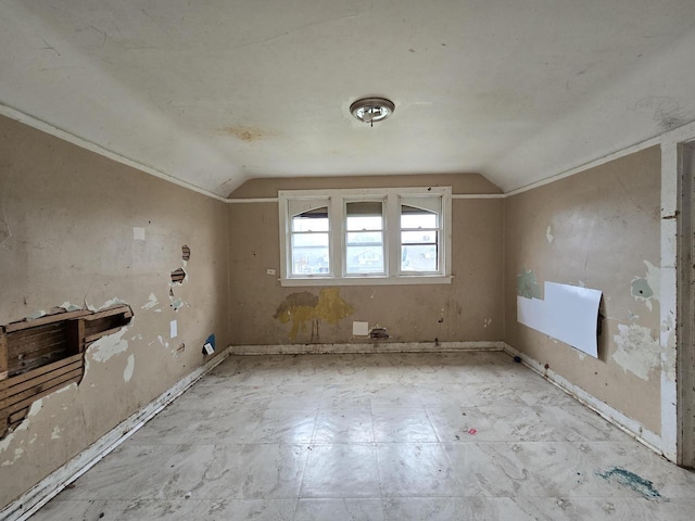 additional living space featuring vaulted ceiling