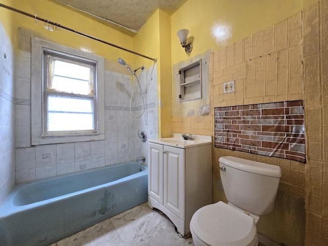 bathroom with vanity, marble finish floor, toilet, and shower / washtub combination