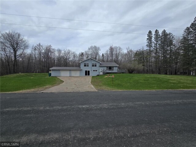 439 270th Ave, Cumberland, WI 54829 - view of front of property with driveway, a front yard, and a garage