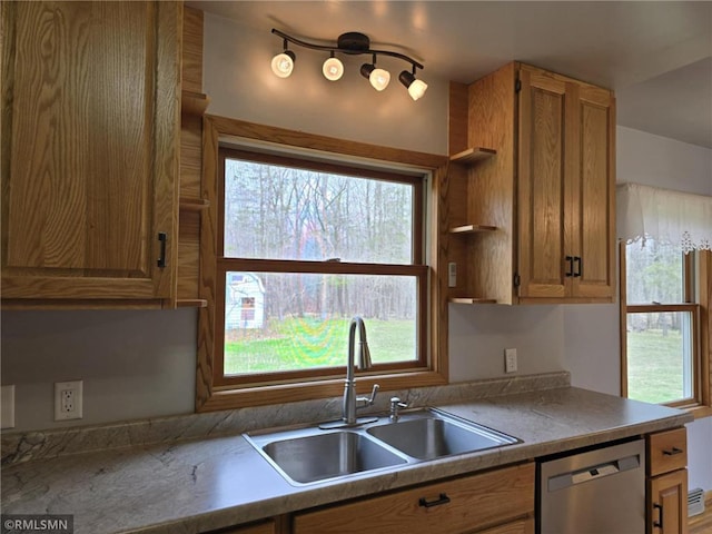 439 270th Ave, Cumberland, WI 54829 - kitchen with a sink, stainless steel dishwasher, open shelves, and brown cabinetry