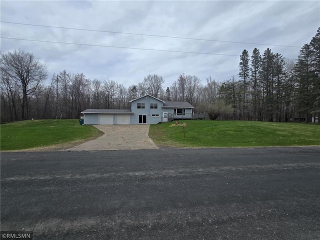 439 270th Ave, Cumberland, WI 54829 - view of front of home with driveway, a front yard, and a garage