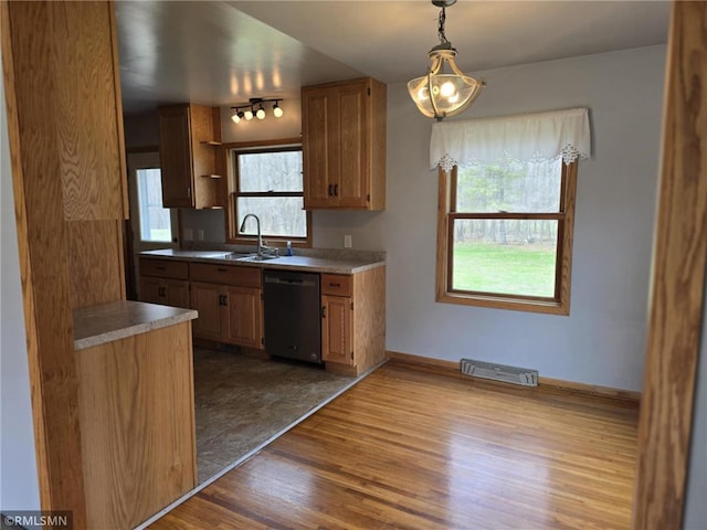 439 270th Ave, Cumberland, WI 54829 - kitchen featuring visible vents, hanging light fixtures, wood finished floors, dishwasher, and a sink