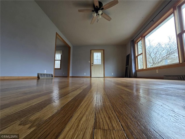 439 270th Ave, Cumberland, WI 54829 - unfurnished room featuring baseboards, a ceiling fan, and wood finished floors