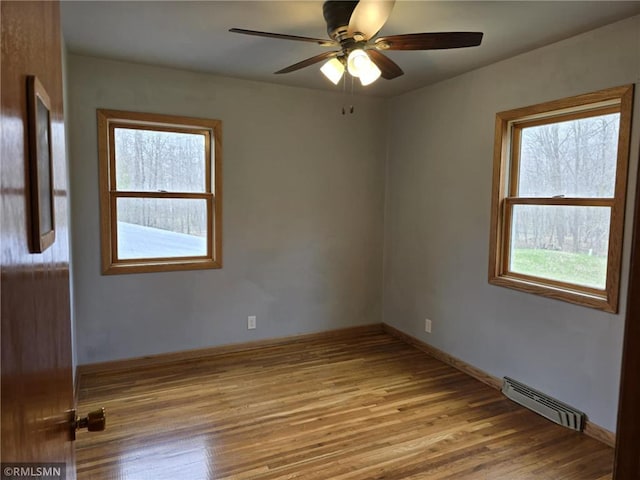 439 270th Ave, Cumberland, WI 54829 - spare room with visible vents, a ceiling fan, baseboards, and wood finished floors
