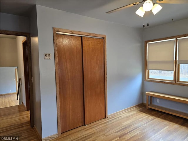 439 270th Ave, Cumberland, WI 54829 - unfurnished bedroom with baseboards, a closet, and light wood finished floors