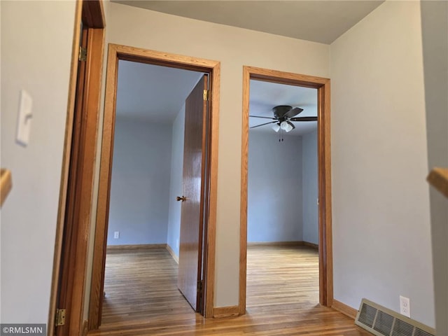 439 270th Ave, Cumberland, WI 54829 - hall with baseboards, visible vents, and wood finished floors