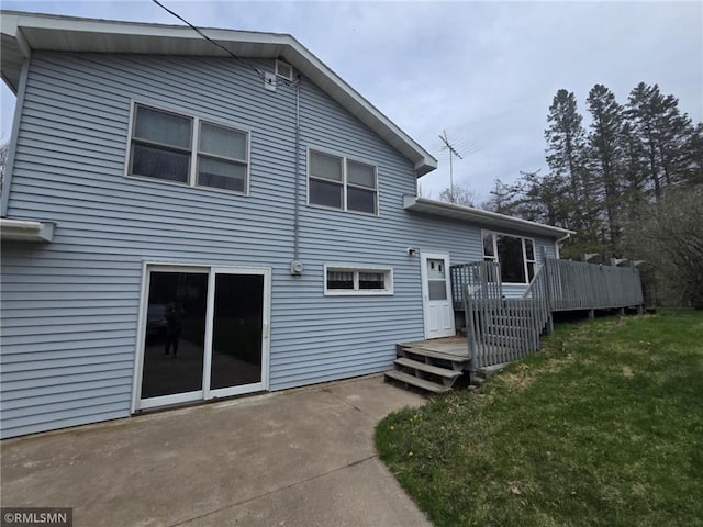 439 270th Ave, Cumberland, WI 54829 - rear view of property featuring a lawn, a wooden deck, and a patio area