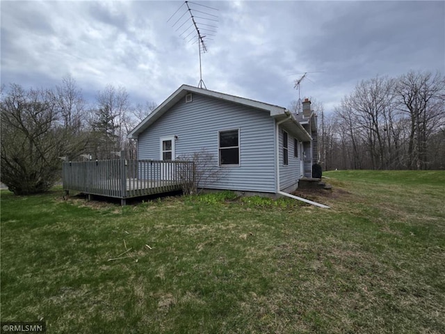 439 270th Ave, Cumberland, WI 54829 - view of property exterior featuring a yard, a chimney, and a wooden deck