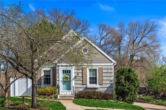 view of front of property featuring fence