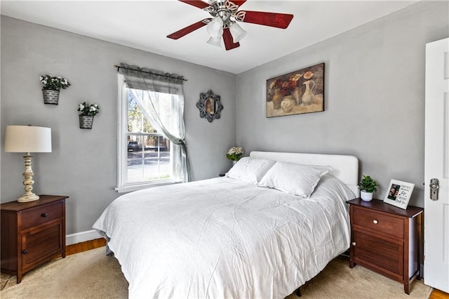 bedroom featuring baseboards and a ceiling fan