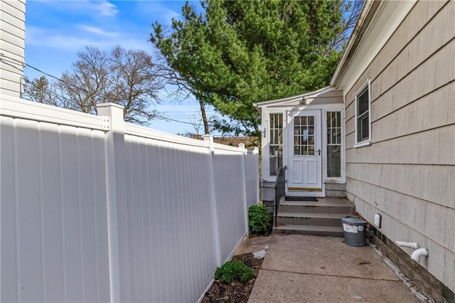view of property exterior featuring fence