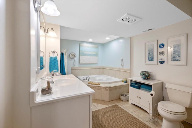 full bathroom with tile patterned flooring, a garden tub, visible vents, vanity, and toilet