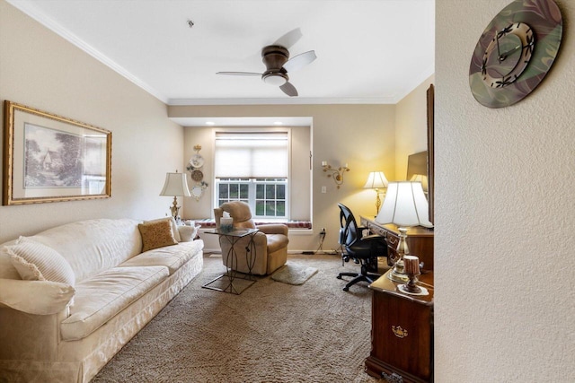 office area with ornamental molding, carpet, and a ceiling fan