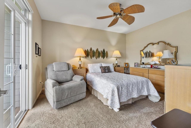 bedroom featuring a ceiling fan, light carpet, and access to exterior