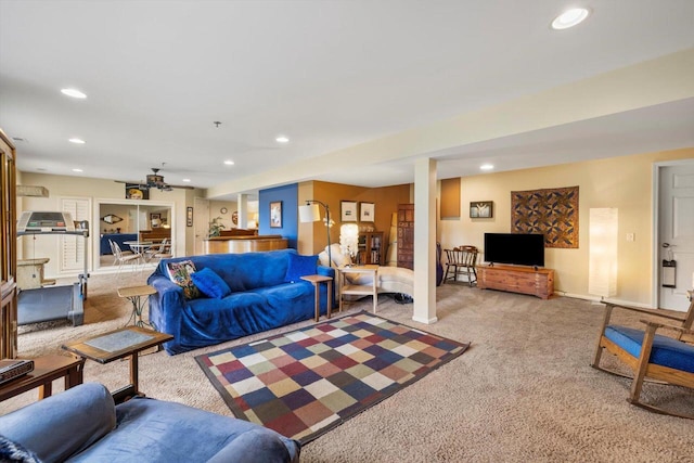 living area with baseboards, carpet, and recessed lighting