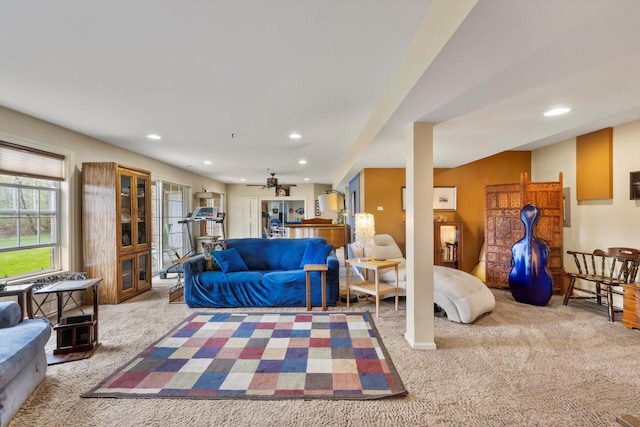 carpeted living area with recessed lighting