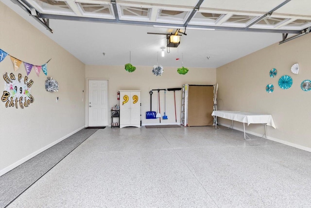 garage with baseboards and a garage door opener