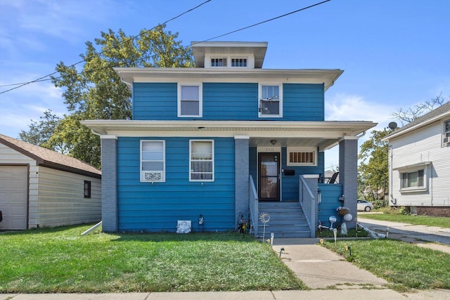 2311 20th St, Racine, WI 53403 - american foursquare style home with covered porch and a front lawn
