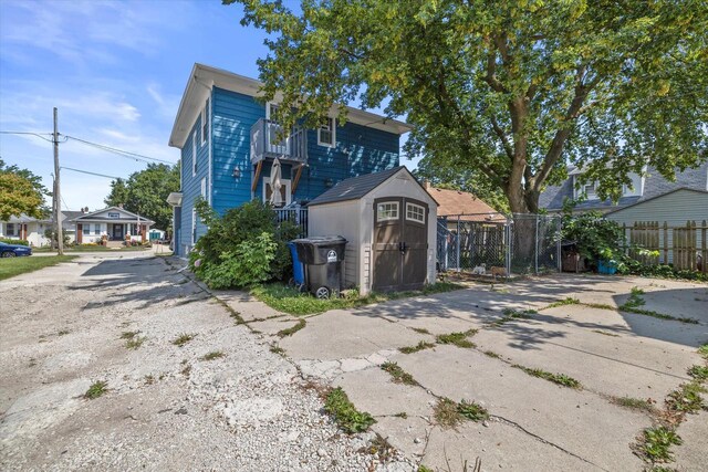 2311 20th St, Racine, WI 53403 - exterior space featuring a storage shed, fence, and an outbuilding