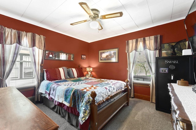 carpeted bedroom with a ceiling fan