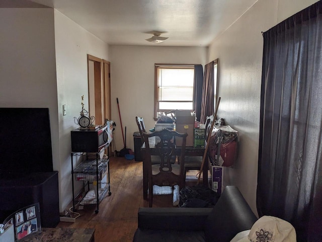 dining room with a ceiling fan and wood finished floors