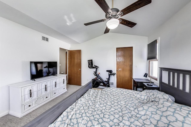 carpeted bedroom with visible vents, ceiling fan, and vaulted ceiling