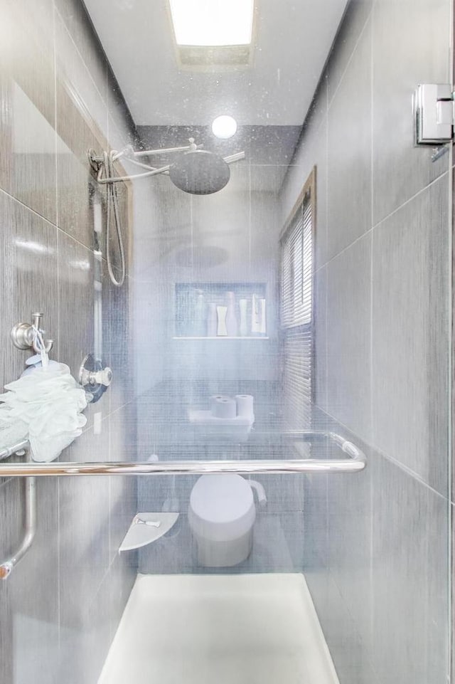 full bathroom with a shower stall