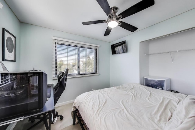 carpeted bedroom with baseboards and a ceiling fan
