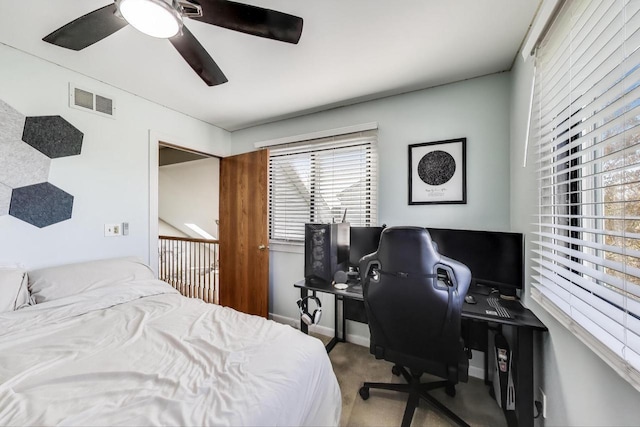 bedroom with carpet flooring, ceiling fan, and visible vents
