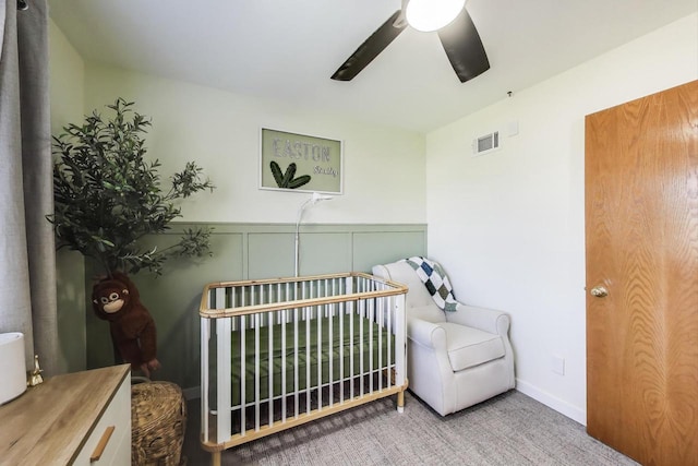bedroom with visible vents, carpet flooring, and ceiling fan