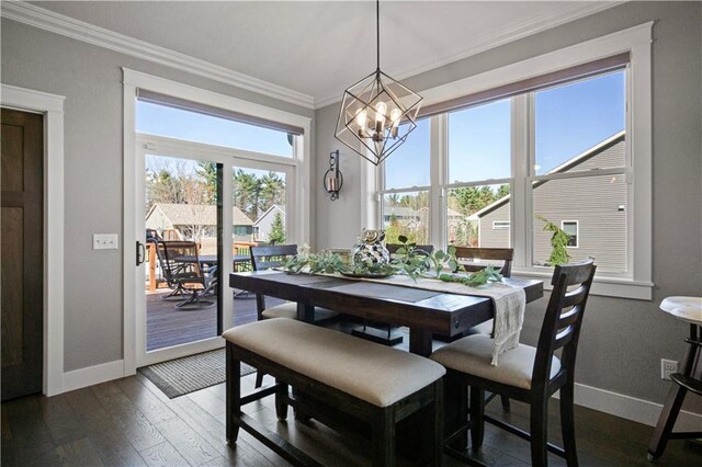 2931 Drier Rd, Eau Claire, WI 54701 - dining area with crown molding, dark wood-style flooring, baseboards, and an inviting chandelier
