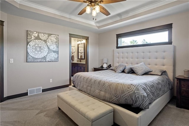 2931 Drier Rd, Eau Claire, WI 54701 - carpeted bedroom featuring baseboards, ensuite bathroom, a tray ceiling, visible vents, and ornamental molding
