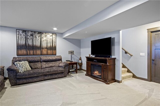 2931 Drier Rd, Eau Claire, WI 54701 - living room featuring stairway, baseboards, carpet flooring, and a glass covered fireplace