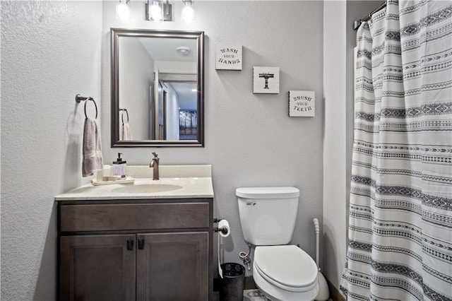 2931 Drier Rd, Eau Claire, WI 54701 - full bath with toilet, a textured wall, curtained shower, and vanity
