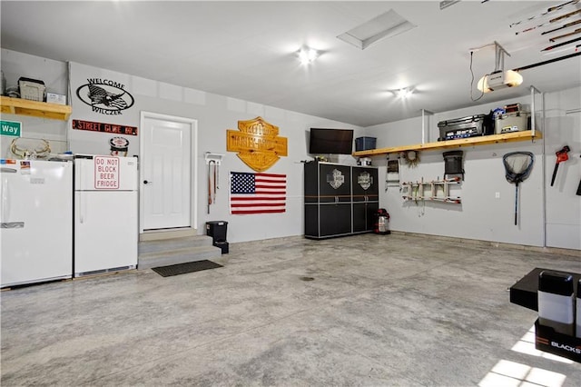 2931 Drier Rd, Eau Claire, WI 54701 - garage with freestanding refrigerator and a garage door opener