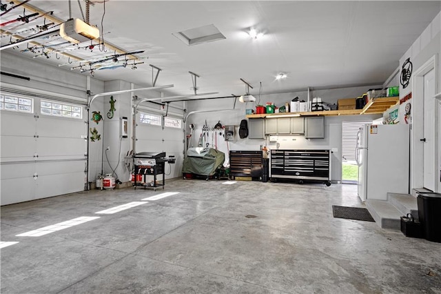 2931 Drier Rd, Eau Claire, WI 54701 - garage with freestanding refrigerator and a garage door opener