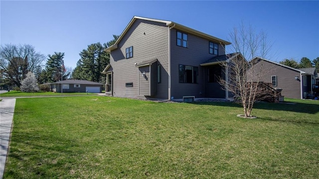 2931 Drier Rd, Eau Claire, WI 54701 - rear view of house with a yard