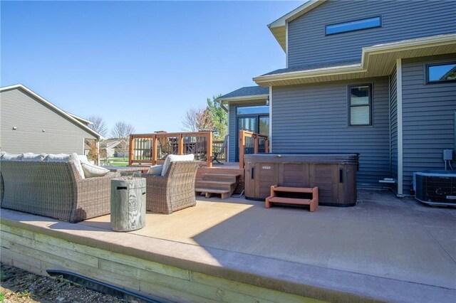 2931 Drier Rd, Eau Claire, WI 54701 - view of patio with a wooden deck, a hot tub, and cooling unit